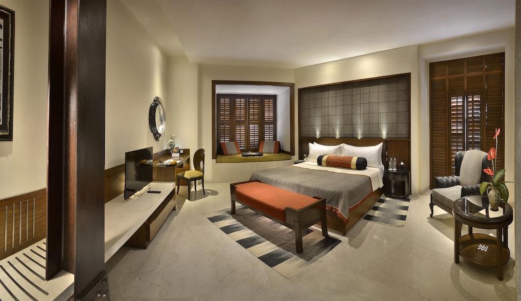 The Lalit Great Eastern Kolkata Hotel Room photo A bedroom at the Taj Mahal Palace